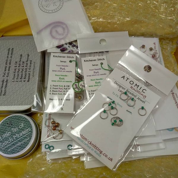 Atomic Knitting Notions and Stitch Markers
