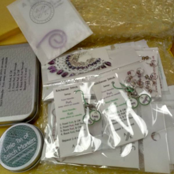 Atomic Knitting Notions and Stitch Markers